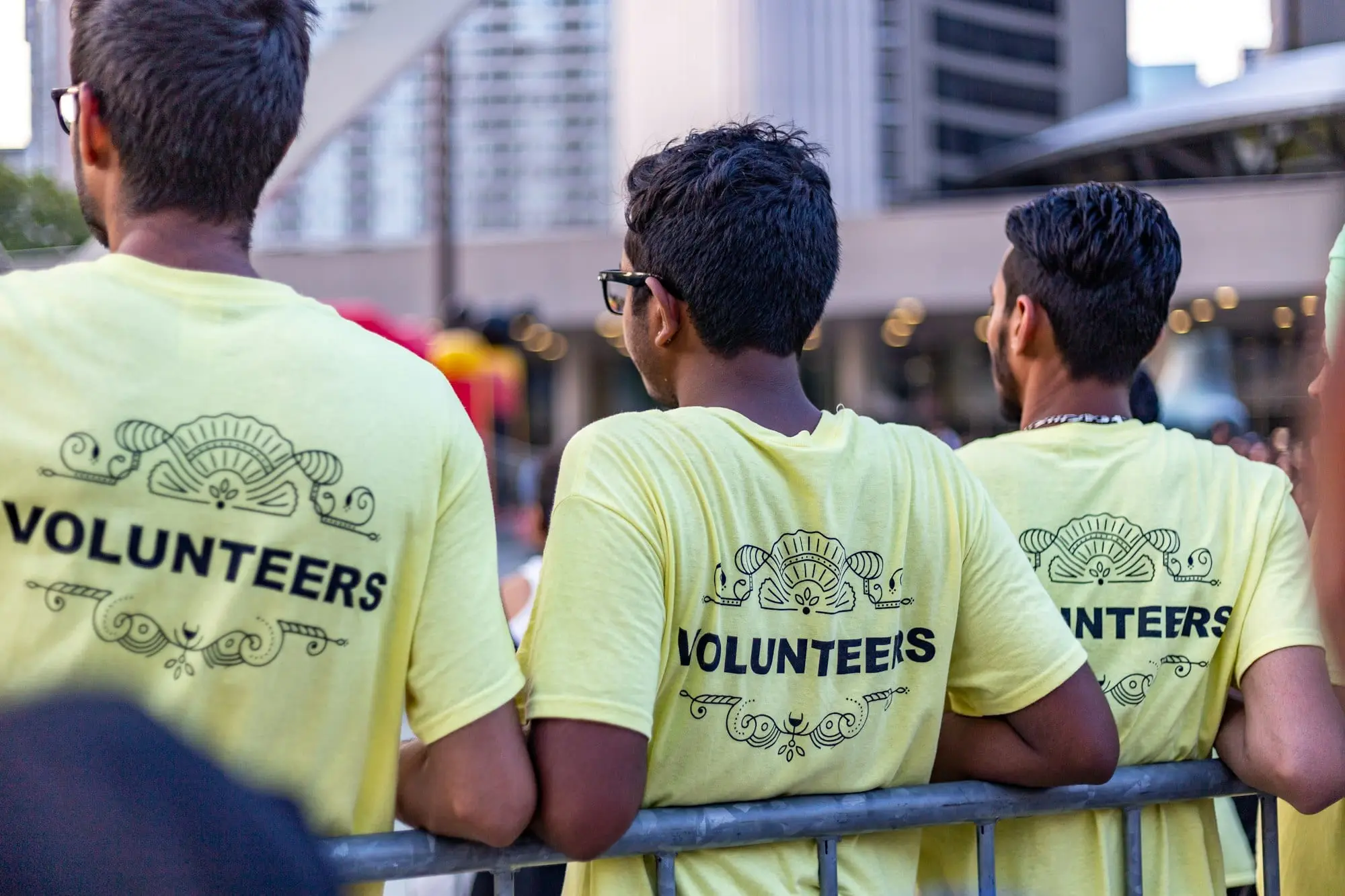 Volunteers in yellow shirts at a community event
