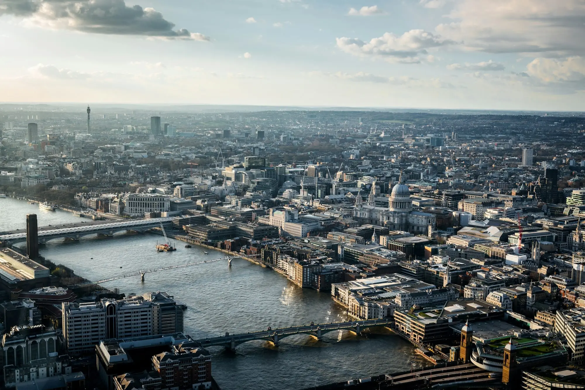 Elevated view of the City of London and the River Thames with its bridges on a cloudy afternoon